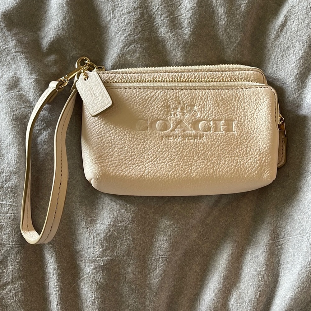 Like new, cream, coach wristlet